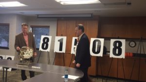 Chairman of the Board Stet Schanze draws the winning number for the 2016 Shop St. Joseph drawing.